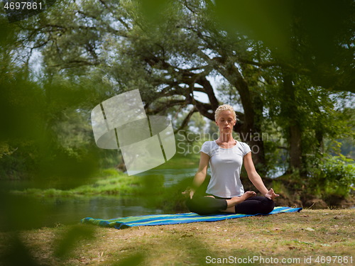 Image of woman meditating and doing yoga exercise