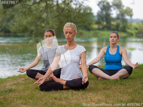 Image of women meditating and doing yoga exercise