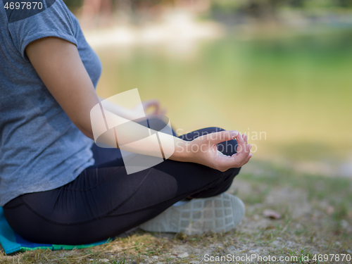 Image of woman meditating and doing yoga exercise