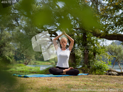 Image of woman meditating and doing yoga exercise