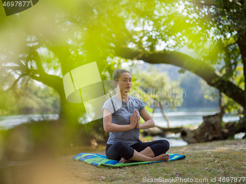 Image of woman meditating and doing yoga exercise