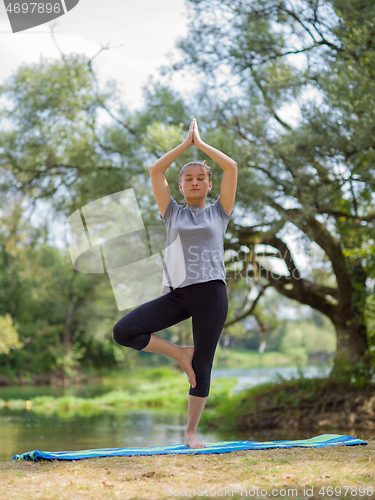 Image of woman meditating and doing yoga exercise