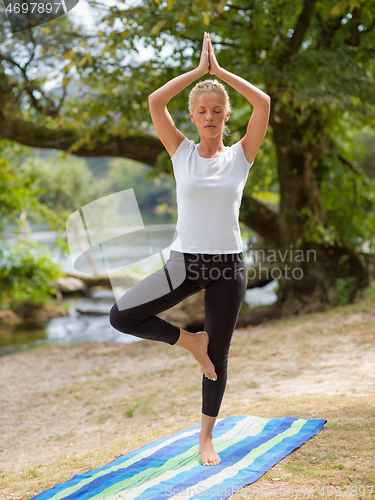 Image of woman meditating and doing yoga exercise