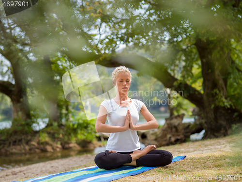 Image of woman meditating and doing yoga exercise