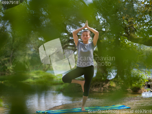 Image of woman meditating and doing yoga exercise