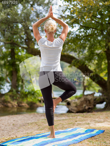 Image of woman meditating and doing yoga exercise