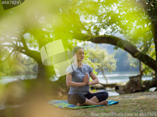 Image of woman meditating and doing yoga exercise