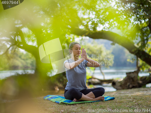 Image of woman meditating and doing yoga exercise