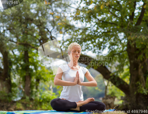 Image of woman meditating and doing yoga exercise