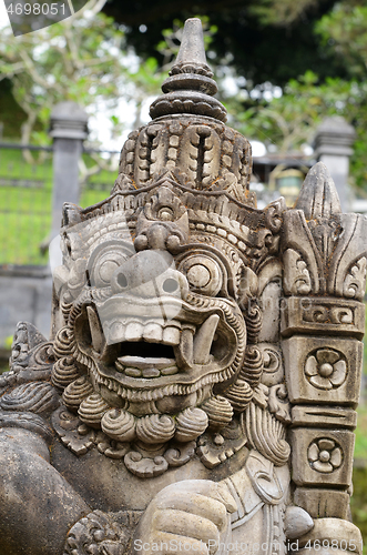 Image of Bali sculpture in front of temple