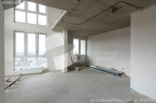 Image of Interior of a spacious two-story apartment without renovation in a new rented house