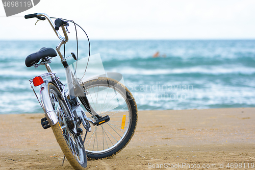Image of Close-up bike stands on the sea coast