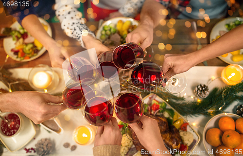 Image of close up of friends with wine celebrate christmas