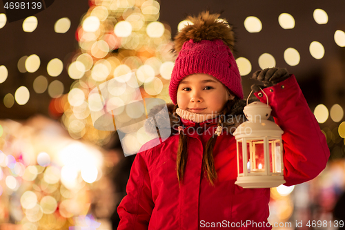 Image of happy little girl at christmas with lantern market