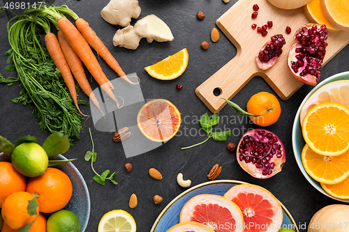 Image of different vegetables and fruits on on slate table