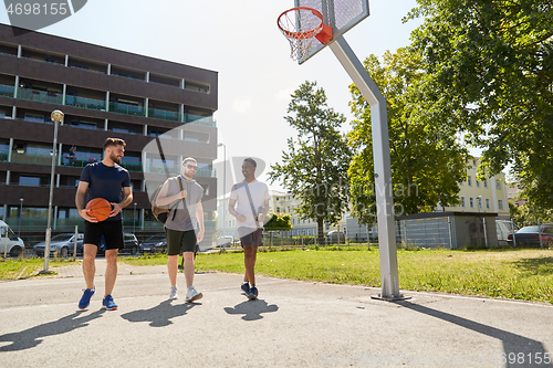 Image of group of male friends going to play basketball