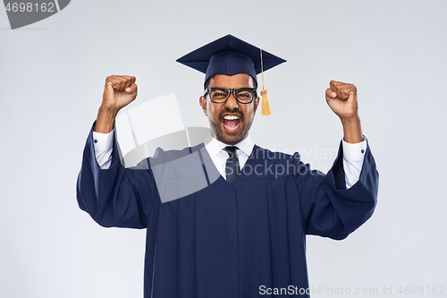 Image of happy indian graduate student celebrating success