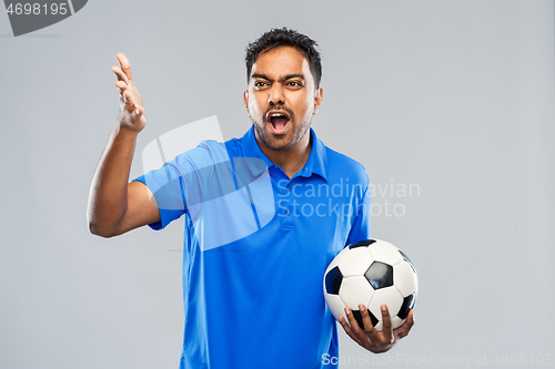 Image of angry indian male football fan with soccer ball