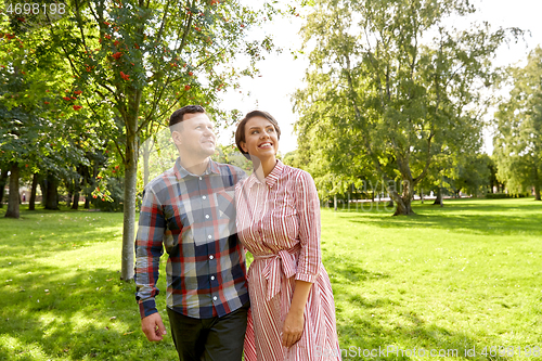 Image of happy couple in summer park