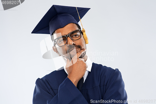 Image of indian graduate student in mortar board thinking