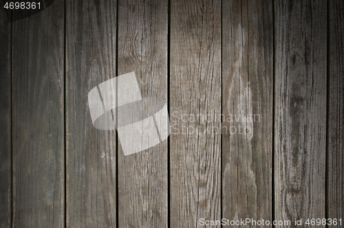 Image of Weathered wooden planking background lit from above