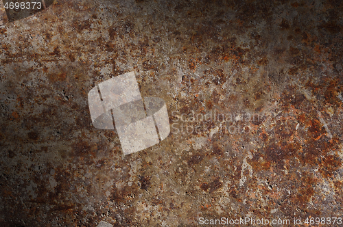 Image of Corroded and rusty surface lit diagonally