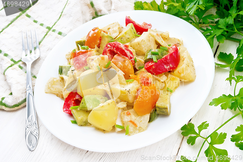 Image of Ragout vegetable with zucchini on wooden board