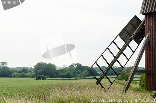 Image of Old windmill in a farmland 