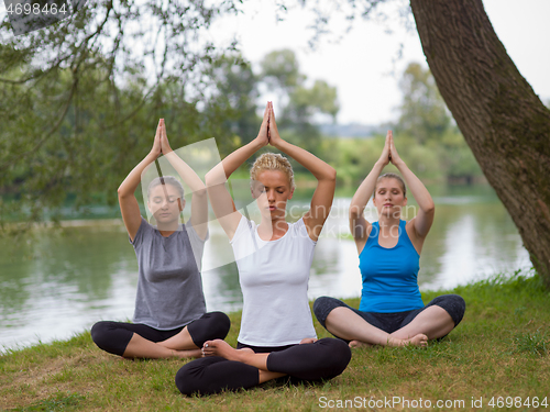 Image of women meditating and doing yoga exercise
