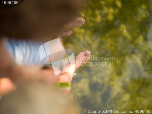 Image of Couple eating watermelon enjoying picnic time