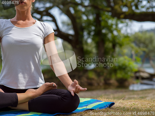 Image of woman meditating and doing yoga exercise