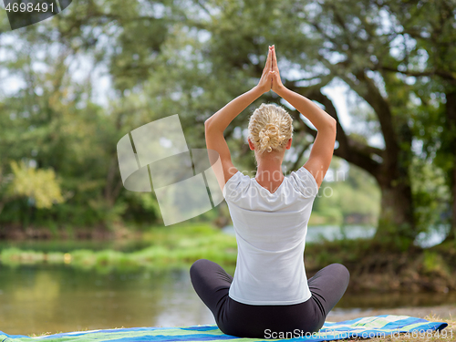 Image of woman meditating and doing yoga exercise