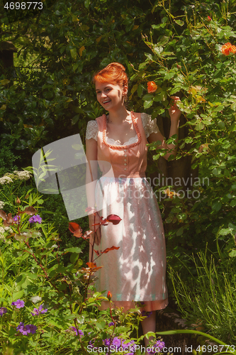 Image of Happy Bavarian girl in your garden