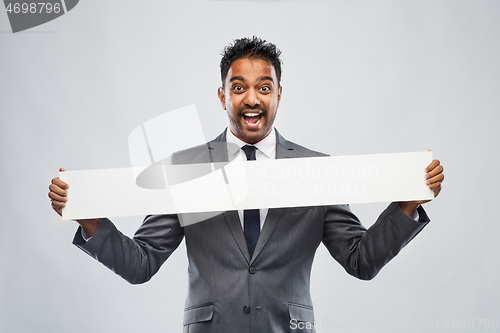 Image of happy indian businessman with white banner