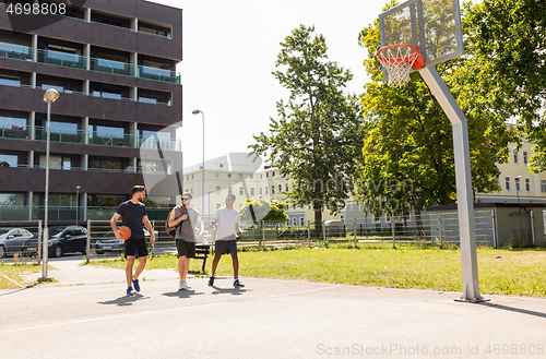 Image of group of male friends going to play basketball