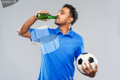 Image of indian male football fan with soccer ball and beer