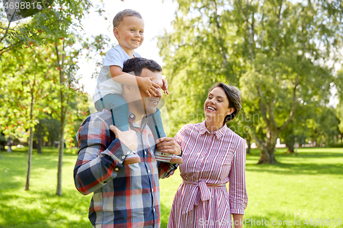 Image of happy family having fun at summer park