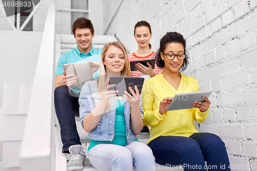 Image of high school students with tablet computers