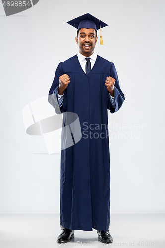 Image of happy indian graduate student in mortar board