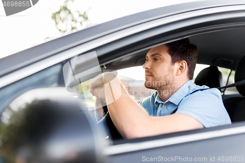 Image of man or driver driving car in summer