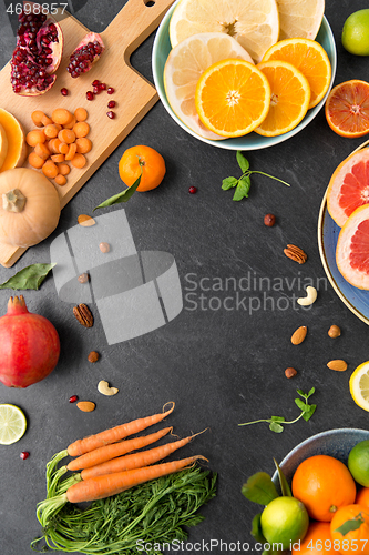 Image of different vegetables and fruits on on slate table