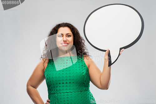 Image of happy woman in green dress holding speech bubble