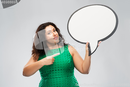 Image of happy woman in green dress holding speech bubble