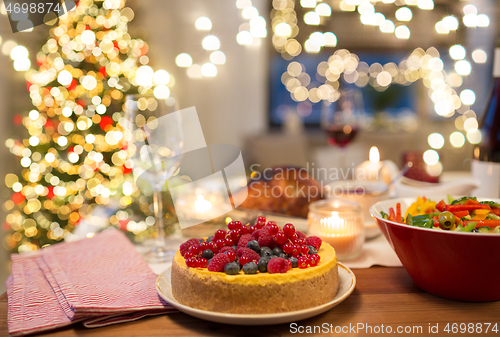 Image of cake and other food on christmas table at home