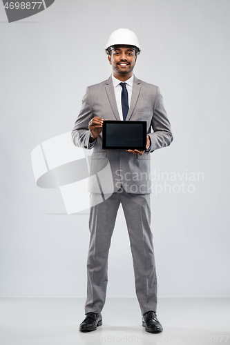 Image of indian architect in helmet with tablet computer