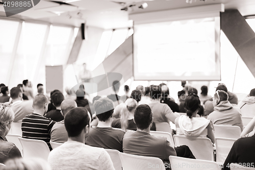 Image of Male speeker having talk at public event.