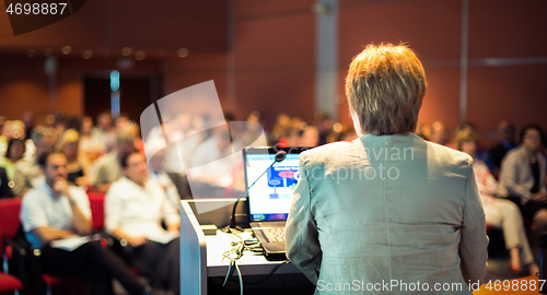 Image of Business woman lecturing at Conference.