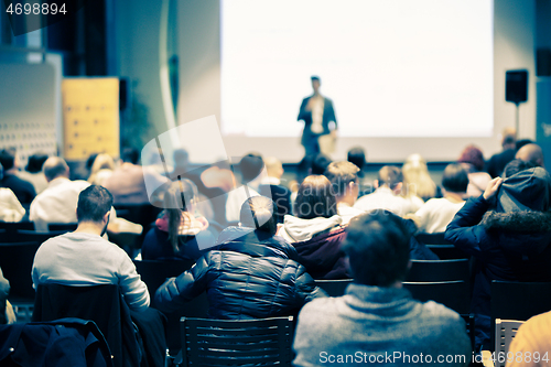 Image of Business speaker giving a talk at business conference event.