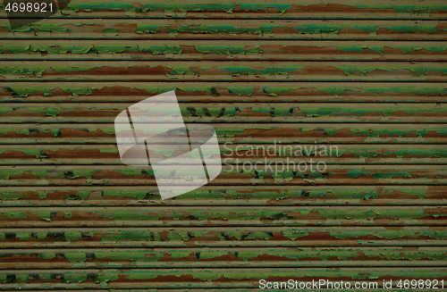 Image of Old metal shutters with grunge green paint