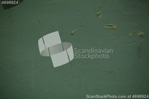 Image of Green wall background texture with flaky paint